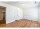 Bright bedroom features wood flooring and a neutral color palette, creating a warm and inviting space at 2357 Riding Trail Rd, Gastonia, NC 28054