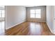 Spacious bedroom features hardwood flooring and natural light from the large window at 2357 Riding Trail Rd, Gastonia, NC 28054