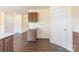 This kitchen features wood grain flooring and upper and lower cabinets and drawers at 2357 Riding Trail Rd, Gastonia, NC 28054