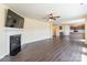 Spacious open concept living room with laminate floors, fireplace, and view into the kitchen at 2357 Riding Trail Rd, Gastonia, NC 28054
