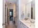 Hallway bathroom with white vanity, and Mickey Mouse decor at 27246 Preston Pl, Fort Mill, SC 29707