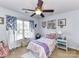 Bright bedroom features a ceiling fan, window and comfortable furnishings at 27246 Preston Pl, Fort Mill, SC 29707