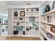 Built-in bookcase features crown moulding detail and ample shelving for displaying books and decor at 27246 Preston Pl, Fort Mill, SC 29707