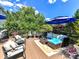 Outdoor living area features a deck with comfortable furniture, fountain and landscaping at 27246 Preston Pl, Fort Mill, SC 29707