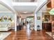 Spacious foyer with gleaming hardwood floors and elegant decor welcomes guests with style at 27246 Preston Pl, Fort Mill, SC 29707