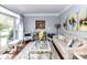 Comfortable living room with large window, stylish decor, and hardwood floors at 27246 Preston Pl, Fort Mill, SC 29707