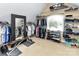 Walk-in closet with extensive shelving and hanging racks for ample storage and a full length mirror at 27246 Preston Pl, Fort Mill, SC 29707
