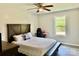 Comfortable bedroom with an accent bench and a window providing plenty of natural light and backyard views at 2921 Heavners Farm Ct, Lincolnton, NC 28092