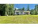 Charming single-story home with a well-manicured lawn and welcoming front porch and stone landscape at 2921 Heavners Farm Ct, Lincolnton, NC 28092