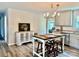 Bright kitchen featuring granite countertops, neutral cabinets, stainless steel appliances, and rustic center island at 2921 Heavners Farm Ct, Lincolnton, NC 28092