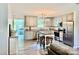 Well-lit kitchen with gray cabinetry, stainless appliances, granite countertops, and a wooden center island at 2921 Heavners Farm Ct, Lincolnton, NC 28092