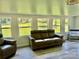 Inviting living room boasts lots of natural light, neutral paint, and gray-toned flooring at 2921 Heavners Farm Ct, Lincolnton, NC 28092