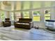 Inviting living room boasts lots of natural light, neutral paint, and gray-toned flooring at 2921 Heavners Farm Ct, Lincolnton, NC 28092