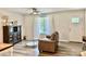 Comfortable living room with stylish decor, laminate floors, and ample natural light from a large window at 2921 Heavners Farm Ct, Lincolnton, NC 28092
