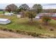 Aerial view featuring the brick home, detached shed, garage, and expansive land at 3113 Old Pageland Marshville Rd, Wingate, NC 28174