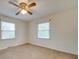 Bright bedroom with a ceiling fan and two windows at 3113 Old Pageland Marshville Rd, Wingate, NC 28174