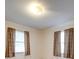 This bedroom has two windows with blinds and neutral walls at 3113 Old Pageland Marshville Rd, Wingate, NC 28174