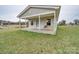 Quaint home exterior featuring a cozy porch with seating, nestled on a sprawling lot with mature trees at 3113 Old Pageland Marshville Rd, Wingate, NC 28174