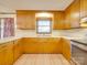 Bright kitchen featuring a window over the sink and traditional wood cabinets at 3113 Old Pageland Marshville Rd, Wingate, NC 28174