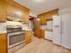 Traditional kitchen with light wood cabinets and stainless steel oven/range at 3113 Old Pageland Marshville Rd, Wingate, NC 28174