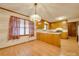 Eat-in kitchen with wood cabinets, laminate counters, and wood-look flooring at 3113 Old Pageland Marshville Rd, Wingate, NC 28174