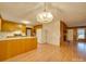 Open concept living area with kitchen and dining area, featuring a fireplace at 3113 Old Pageland Marshville Rd, Wingate, NC 28174