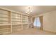 Elegant living room featuring built-in shelving and a large window, providing ample storage and natural light at 3113 Old Pageland Marshville Rd, Wingate, NC 28174