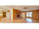 Comfortable living room with a classic brick fireplace and wood accents, adjacent to the kitchen area at 3113 Old Pageland Marshville Rd, Wingate, NC 28174