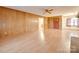 Bright living room with light wood floors and paneling, offering a neutral and welcoming space at 3113 Old Pageland Marshville Rd, Wingate, NC 28174