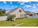 Large backyard featuring an immaculate lawn, white fence and attractive landscaping at 3835 Norman View Dr, Sherrills Ford, NC 28673
