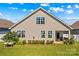 This backyard has an immaculate lawn, white fence, patio and attractive landscaping at 3835 Norman View Dr, Sherrills Ford, NC 28673