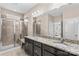 Well-lit bathroom with double sinks, granite countertops, and a glass-enclosed shower at 3835 Norman View Dr, Sherrills Ford, NC 28673