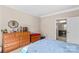 Bright bedroom featuring dresser, decor, and view to an ensuite bathroom at 3835 Norman View Dr, Sherrills Ford, NC 28673