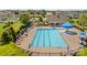 Large community pool with lap lanes, lounge chairs, umbrellas, and a covered area for residents at 3835 Norman View Dr, Sherrills Ford, NC 28673
