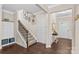 Spacious foyer with hardwood floors, staircase, and decorative wall art at 3835 Norman View Dr, Sherrills Ford, NC 28673