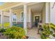 Inviting front porch with decorative columns and front door at 3835 Norman View Dr, Sherrills Ford, NC 28673