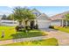 Charming home with well-manicured lawn, mature tree, and a two-car garage at 3835 Norman View Dr, Sherrills Ford, NC 28673