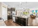 Open kitchen concept featuring granite island with bar seating and views to the dining area and backyard at 3835 Norman View Dr, Sherrills Ford, NC 28673