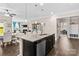 Open-concept kitchen with island seating and seamless connection to the dining and living areas at 3835 Norman View Dr, Sherrills Ford, NC 28673