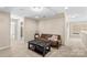 Relaxing living room featuring a brown sofa and a black coffee table at 3835 Norman View Dr, Sherrills Ford, NC 28673