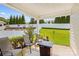 The covered patio has seating, a small table and nice views of the landscaped backyard at 3835 Norman View Dr, Sherrills Ford, NC 28673