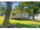 Charming home with well-maintained front lawn, mature trees, and inviting front porch at 3973 English Oak Dr, Lincolnton, NC 28092