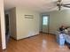 Bright living room with hardwood floors, a ceiling fan, and a back door to the backyard at 3973 English Oak Dr, Lincolnton, NC 28092