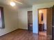 Main bedroom with hardwood floors, a ceiling fan, and an en-suite bathroom at 3973 English Oak Dr, Lincolnton, NC 28092