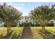 Charming apartment building featuring a symmetrical facade, lush landscaping, and a welcoming entrance at 404 Wakefield Dr # C, Charlotte, NC 28209