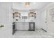 Charming kitchen featuring modern appliances, marble countertops, and white cabinets at 404 Wakefield Dr # C, Charlotte, NC 28209