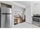 Kitchen view leading into a cozy living room at 404 Wakefield Dr # C, Charlotte, NC 28209