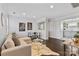 Bright living room boasts a stylish sofa, unique coffee table, and hardwood floors at 404 Wakefield Dr # C, Charlotte, NC 28209
