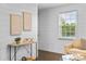 Bright living room featuring stylish decor, hardwood floors, and ample natural light from a window at 404 Wakefield Dr # C, Charlotte, NC 28209