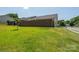Lush green backyard with privacy fence surrounding the property, a perfect area for entertaining at 407 Hertling Nw Dr, Concord, NC 28027